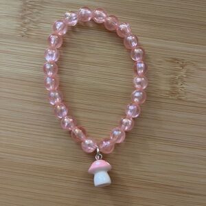 Pink Beaded Bracelet with Mushroom Charm